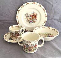 Full set of four items: plate, two-handled cup, cup and saucer, and bowl showing Bunnykins character scenes and border patterns.