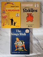 Front covers of three vintage children's books by Bennett Cerf and Benjamin Elkin on white surface.