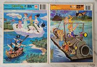 Front view of the two colorful vintage Disney frame tray puzzles side by side. Left is Peter Pan scene with characters flying above sea and pirate ship. Right is The Rescuers scene with mouse characters in motorboat on water.
