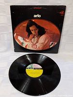 Photo showing the vinyl record disc with the Reprise Records label in the center, black with yellow and green text.