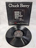 Vinyl record disc showing the label with track information and visible good condition of the vinyl surface.