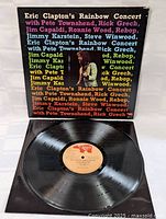 Full view of vinyl record with original label and cover partially visible underneath.