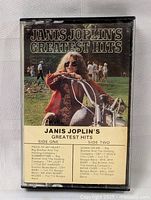 Front view of cassette tape cover showing Janis Joplin on a motorcycle and track list for both sides