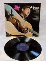 Front view of the LP record partially out of its sleeve showing the vinyl and cover with Johnny Cash's photo.