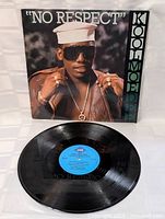 Vinyl record of Kool Moe Dee "No Respect" with blue Jive Records label visible, showing the vinyl surface condition.