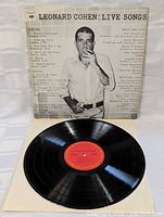 Black vinyl LP with red Columbia label, placed on inner white sleeve, showing good vinyl condition with some sheen without visible scratches.