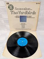 Front and vinyl record visible showing label and condition