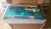 Memory foam & Hydraluxe cooling bed pillow in original packaging inside a box.
