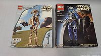 Front view of both LEGO Star Wars Technic sets, Battle Droid #8001 sealed and Jango Fett #8011 opened, showing box artwork and condition.