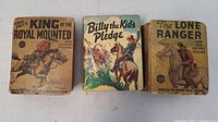 Front covers of the three Western Big Little Books showing titles: Zane Grey's King of the Royal Mounted, Billy the Kid's Pledge, and The Lone Ranger and the Secret Killer.