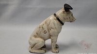 Right side view of white enamel cast iron dog showing overall shape and finish
