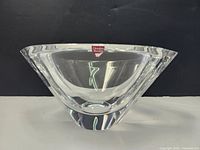 Front angled view of the clear Orrefors crystal bowl with label visible on rim.
