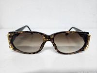 Front view of tortoiseshell framed sunglasses with gradient lenses