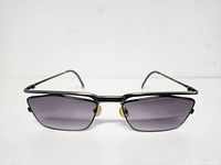 Front view showing rectangular gradient dark grey tinted lenses with black metal frame and nose pads.