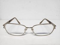 Front view of the vintage Versace eyeglasses showing the rectangular metal frame with clear lenses.