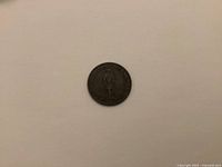 Front side of 1837 half penny coin showing a standing figure and text around the edge.