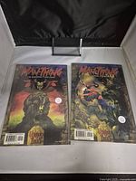 Front covers of Man-Thing Issue #2 and Variant Cover #2B comic books, displayed in protective sleeves.