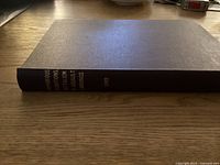 Photo showing the closed hardcover manual with title text on spine 'Amphibious Operations Battalion in Assault Landings 1949'.