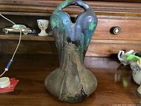 Front view of Austria art pottery vase with green, brown and blue glaze and organic design.