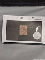 Photo of the used Canadian 2 cent rose Queen Victoria postage stamp mounted on a card with label #20 used, lot 302.