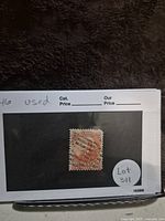 Image of a used 20 cent vermillion Canadian stamp featuring Queen Victoria, catalog number 46, mounted on display card with label Lot 311.