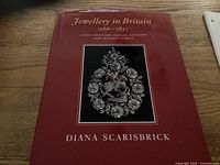 Front cover of the book showing the title and an image of intricate historical jewellery.