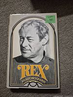 Front cover of Rex Harrison autobiography showing a black and white portrait of Rex Harrison with the title in bold orange and white text.