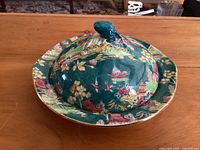 Full view of the covered Royal Winton Pekin Green muffin dish showing detailed oriental scenic pattern on lid and dish