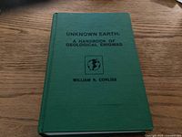 Photo of the book 'Unknown Earth: A Handbook of Geological Enigmas' showing the front cover with title and author.