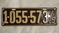 Front side of 1925 Illinois license plate showing black background and embossed white characters '1-055-573 LL 25'