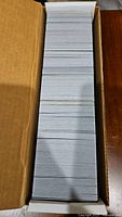Box of neatly stacked Magic The Gathering cards seen from top