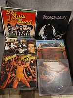 Photo of a stack of vintage vinyl record albums including The J. Geils Band, Best of Leon, Jackson Browne, and a few others with illustrated covers