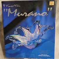 Original box for the Murano glass centerpiece showing the label and branding.