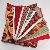 First image shows folded fabric fat quarters with autumn-themed and geometric patterns, mostly brown, red, and orange tones