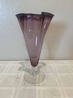 Front view of the deep purple handkerchief vase showing the tapered body and clear glass base.
