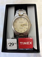 Men's Timex Armitron quartz wristwatch in original box with price tag and brand label visible.