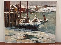 Front view of the oil painting showing winter fishing boats docked at pier with snow and seaside town in background.