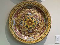 Front view of full charger showing overall baroque floral design