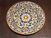 Full top view of platter displaying complete baroque floral design