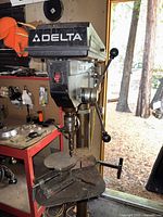 Front view of Delta drill press showing head, column and base