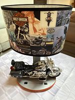 Front-right angled view of the Harley Davidson motorcycle lamp with detailed motorcycle base and Harley Davidson graphic lampshade.