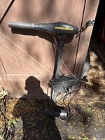 Full view of Minn Kota Endura C2 trolling motor hung on shed door