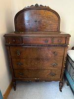 Front view of dresser with arched double-door cubby closed
