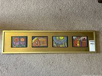 Four colorful abstract Japanese prints framed together, each with a gold matte and gold rectangular frame.