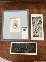 Lot contents showing three prints including the framed 'Loon Jewel' and two black and white reproductions on paper