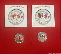Two 2012 Canadian silver plated 1 cent coins with colorized maple leaf designs displayed on red background, each with a Certificate of Authenticity.