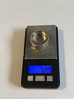 Sterling silver ring placed on a digital scale showing a weight of 7.20 grams.