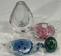 Group shot of all items showing size and relative proportions; includes Orrefors bud vases, Edinburgh rose teapot, Kerry egg, and sea turtle figurine.