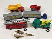 Full lot overview showing six die cast trucks with visible wear and missing parts.