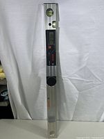 Full view of the Bosch digital angle level showing its length and structure upright against a white background.